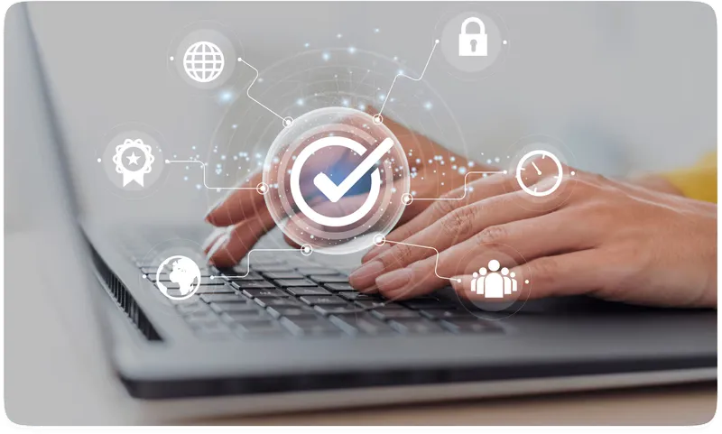 Hands typing on a laptop with a glowing checkmark and security icons overlaid, including a padlock and globe